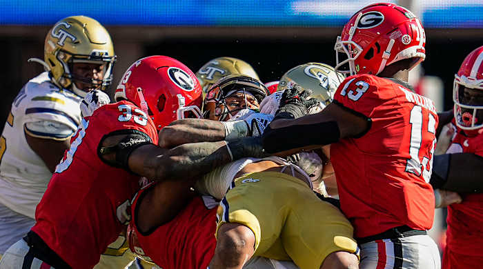 Georgia defenders stop Georgia Tech from gaining much yardage.